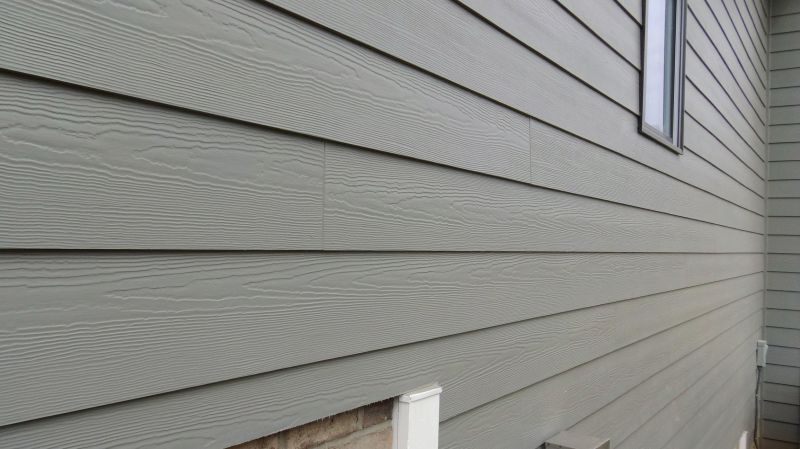 Fiber cement siding being painted